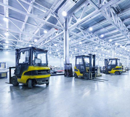 A row of fork-lift trucks in a warehouse - Boyd Insurance