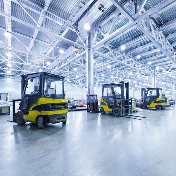 A row of fork-lift trucks in a warehouse - Boyd Insurance