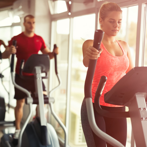 People using gym equipment in a sports centre - Boyd Insurance