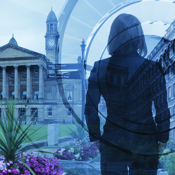 A member of staff standing in Paisley, where Boyd Insurance is based.