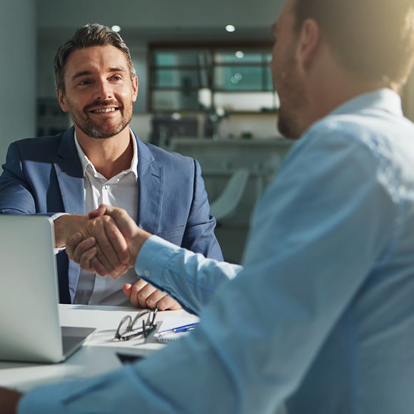 Two Businessmen shaking Hands - Boyd Insurance