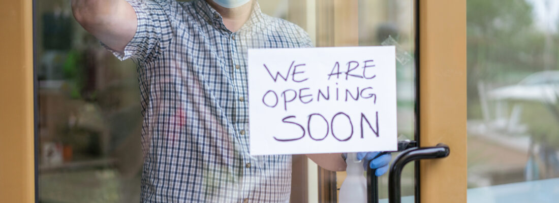 Small business owner cleaning and sanitizing the shop premises after Covid-19 quarantine